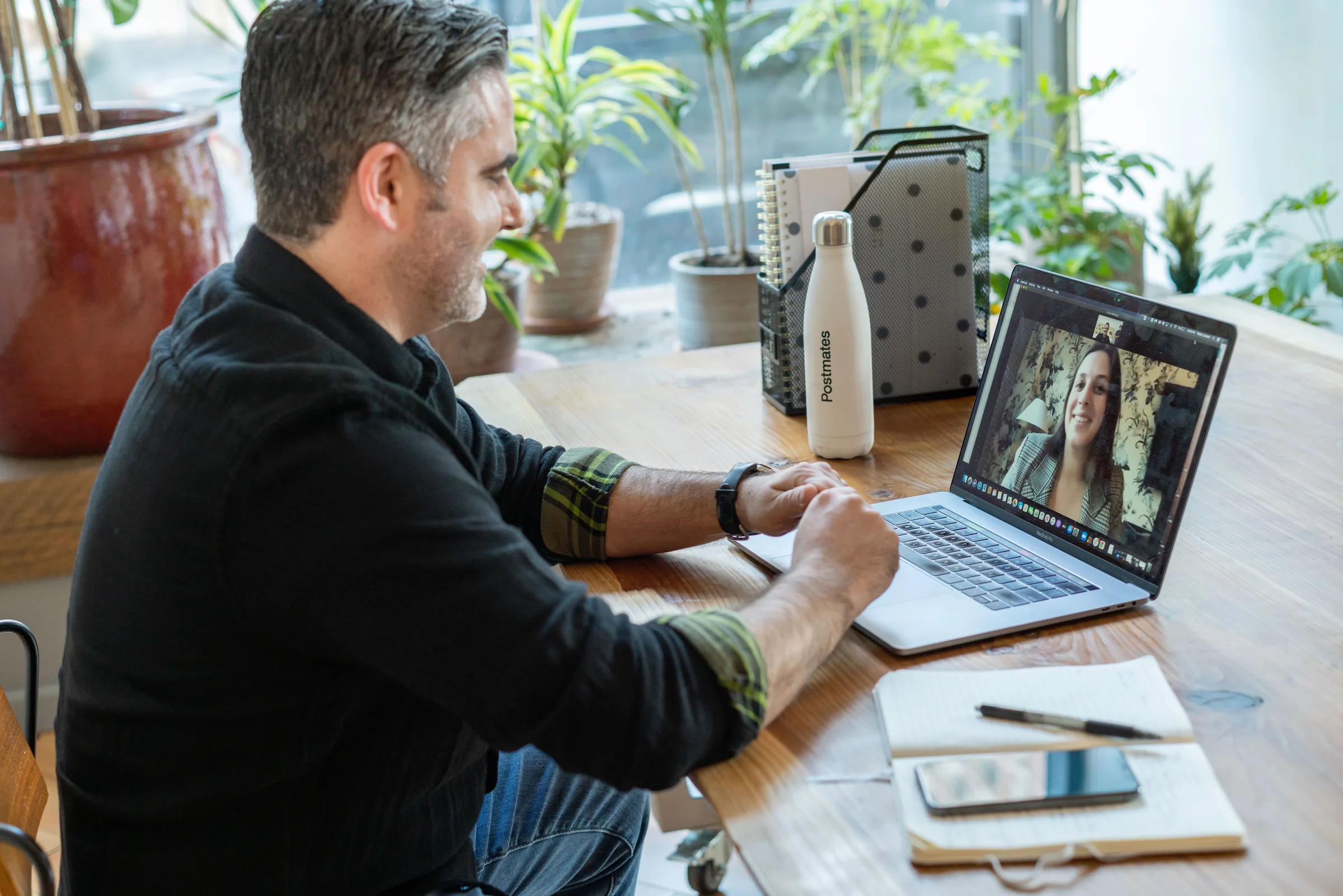 A founder on a video call from a home office desk